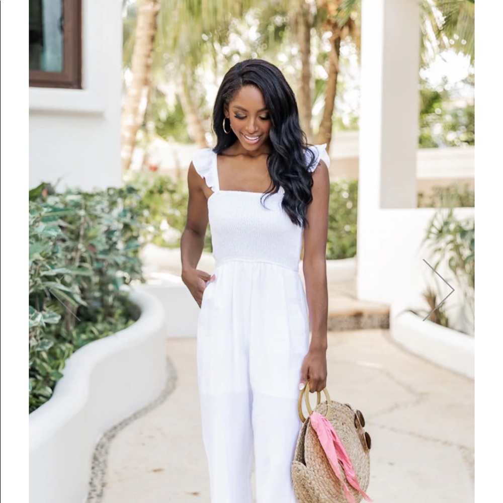 White pink lily jumpsuit brand new never worn. Paid $48 US$